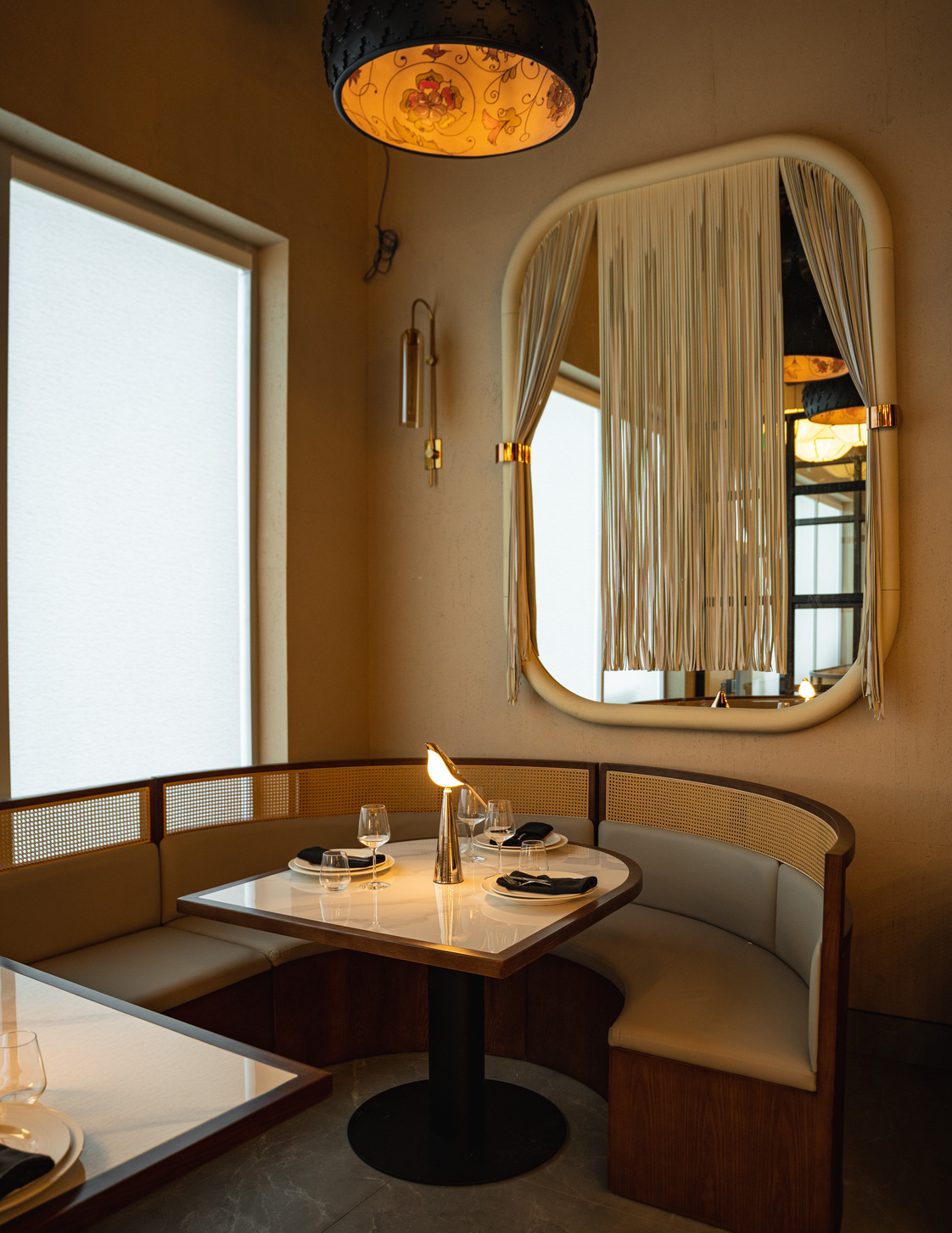 A curved booth set for two