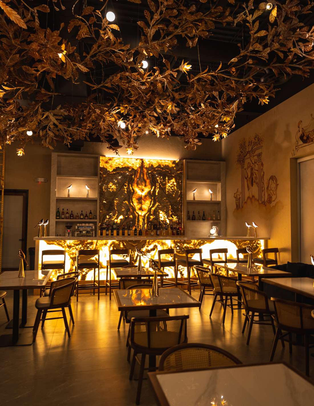 The dining room, warm light under the canopy